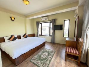 Postel nebo postele na pokoji v ubytování Hotel Khumbila