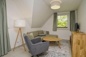 TV/trung tâm giải trí tại Rex Rugia FeWo17-5 mit Schwimmbad und Saunanutzung im AHOI-Erlebnisbad Sellin