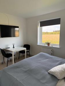 Postel nebo postele na pokoji v ubytování Guesthouse Hune