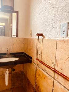 a bathroom with a sink and a mirror at Ondas do Mar in Taíba +34 photos
