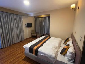 Postel nebo postele na pokoji v ubytování Hotel Khumbila
