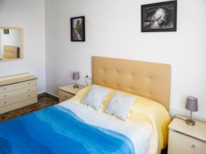 a bedroom with a large bed and two night stands at Apartamento La Mariola in Bocairent +37 photos