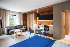 a living room with a couch and a table at Ema in Palanga