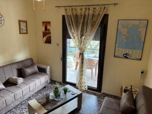 A seating area at ''Mary's House'' Entire residence Olympiada Halkidiki Near to Sea 200m !