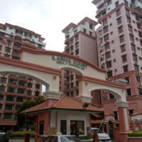 a building in front of some tall buildings at HP Vacation Marina Court in Kota Kinabalu