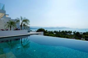 a swimming pool with a view of the ocean at 3 Bedroom Sea View Villa Escape SDV086-By Samui Dream Villas in Bophut 