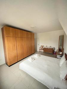 Postel nebo postele na pokoji v ubytování Bookly Apartments