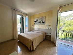 Postel nebo postele na pokoji v ubytování Hotel Feluca + 37 fotografií