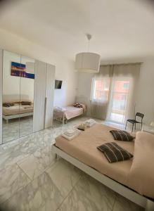 Postel nebo postele na pokoji v ubytování Ennio Rooms