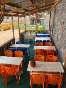 a row of tables and chairs in a restaurant at Renova-Immo in Yaoundé