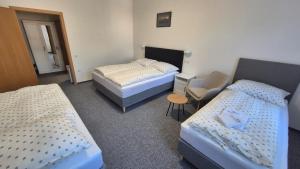 Ліжко або ліжка в номері Hotel Radnice Dobrovice