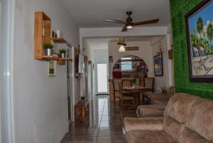 a living room with a couch and a table at VSS Rustic in Arecibo - Stylish & Relaxing Escape Near Beaches in Arecibo
