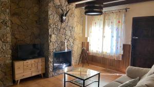 Televízia a/alebo spoločenská miestnosť v ubytovaní Apartamento Rural Sierra de Segura