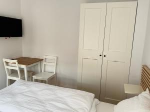 Posteľ alebo postele v izbe v ubytovaní Apartamenty Studio