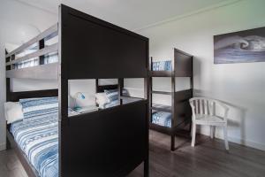 Posteľ alebo postele v izbe v ubytovaní H.A.N.D Surf Hostel