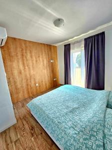 Postel nebo postele na pokoji v ubytování Nina