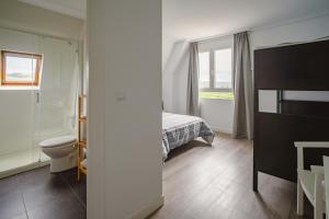 Posteľ alebo postele v izbe v ubytovaní H.A.N.D Surf Hostel