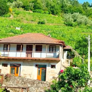 a house on the side of a mountain at D. Maria São Pedro de Balsemão in Lamego