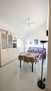 a kitchen and dining room with a table and chairs at Maison Vita in beautiful Maratea in Maratea