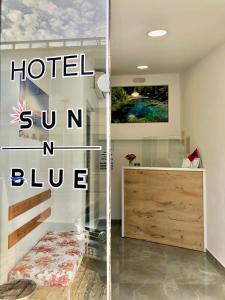 a room with a hotel sun and blue at Sun N Blue Hotel in Sarandë