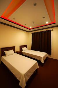 Aba-SHAH GUEST HOUSE SKARDU客房内的一张或多张床位