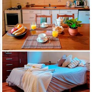 a kitchen with a table with breakfast foods and orange juice at Claro del Bosque in San Carlos de Bariloche