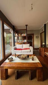a living room with a coffee table and a couch at Tribu in Viña del Mar