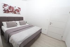 Postel nebo postele na pokoji v ubytování Mamma Mia Apartments