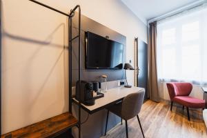 Telewizja i/lub zestaw kina domowego w obiekcie Stary Rynek Old Market Apartments