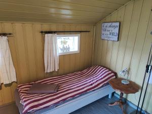 Postel nebo postele na pokoji v ubytování Bie huset