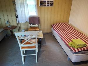 Postel nebo postele na pokoji v ubytování Bie huset