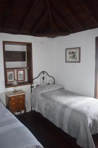 Postel nebo postele na pokoji v ubytování Casa Gelisa