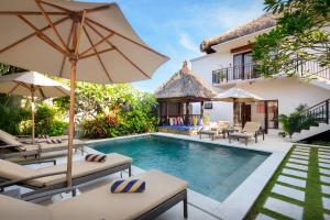 an image of a villa with a swimming pool at Coconuts Villa Balangan Beach in Jimbaran