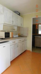 Kuchyň nebo kuchyňský kout v ubytování LiMa Apartman Ház + 13 fotografií