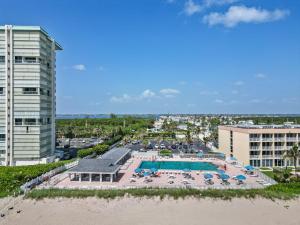 an aerial view of a resort pool and beach at Flip Flop Inn amazing 1 bedroom 1 bath beach bungalow in Jensen Beach