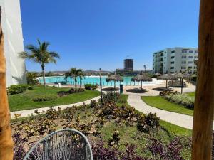 a view of the pool from the balcony of a resort at Mazablue, alberca más grande de México in Mazatlán
