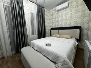 Postel nebo postele na pokoji v ubytování Kobuleti Guest House