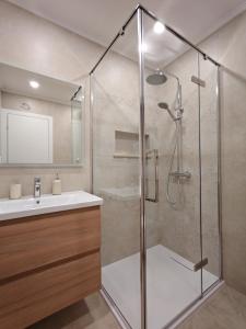 a bathroom with a shower and a sink at Apartments Amfora in Gdinj +53 photos