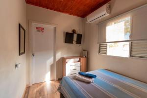 Postel nebo postele na pokoji v ubytování Flat segundo andar Confortável