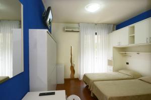 Postel nebo postele na pokoji v ubytování Hotel Ristorante Commercio