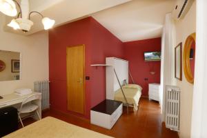 Postel nebo postele na pokoji v ubytování Hotel Ristorante Commercio