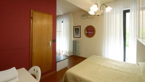 Postel nebo postele na pokoji v ubytování Hotel Ristorante Commercio