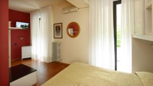 Postel nebo postele na pokoji v ubytování Hotel Ristorante Commercio