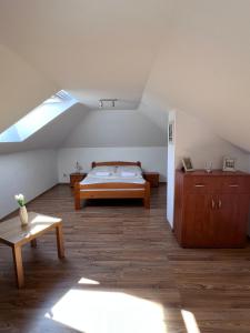 a bedroom with a bed in a attic at Apartamenty Amber Wyspa in Gdańsk