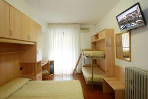 Postel nebo postele na pokoji v ubytování Hotel Ristorante Commercio