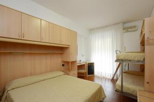Postel nebo postele na pokoji v ubytování Hotel Ristorante Commercio
