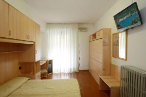 Postel nebo postele na pokoji v ubytování Hotel Ristorante Commercio