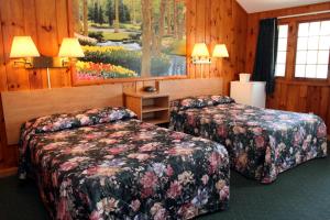 Postel nebo postele na pokoji v ubytování Studio Motel of Lake George