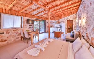 a living room with a couch and a table at Bademlique Stone Rooms in Kaş