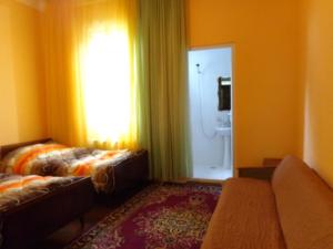Postel nebo postele na pokoji v ubytování White Guest House